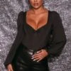 Never Basic Plunge Neck Long Sleeve Bodysuit In Black