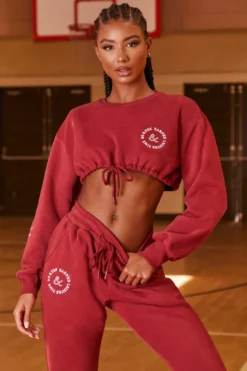 Keep Moving Cropped Drawstring Sweatshirt In Burgundy