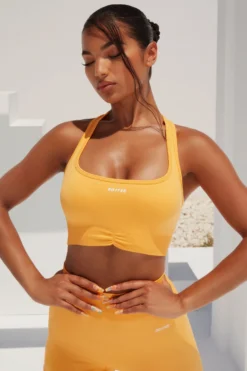 Radiate Ruched Sports Bra In Light Orange